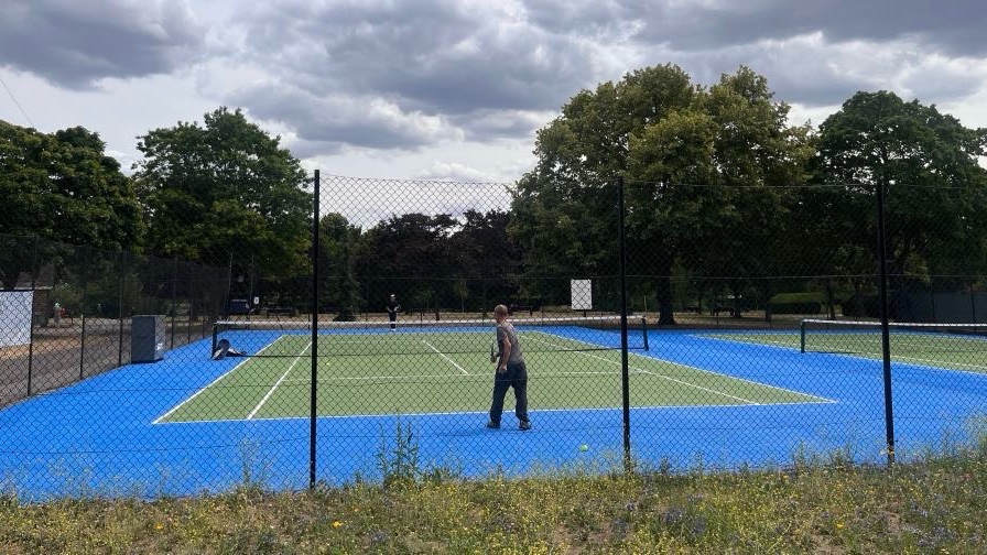 Playing Tennis on a tennis court